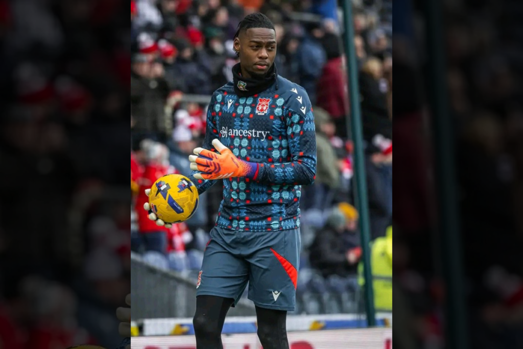 Wrexham goalkeeper Arthur Okonkwo warming up before a game
