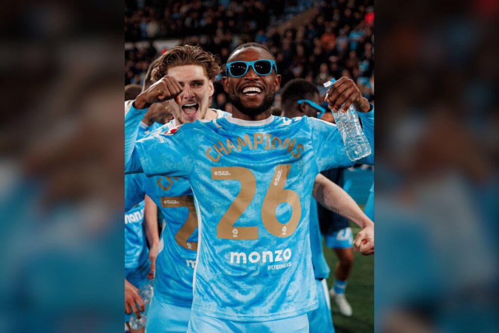 Frank Onyeka celebrating Coventry's promotion with a team mate.