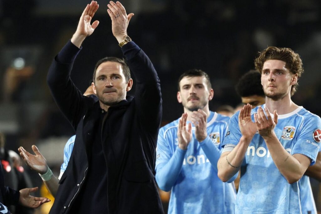 Frank Lampard and some members of his team celebrating Coventry's promotion.