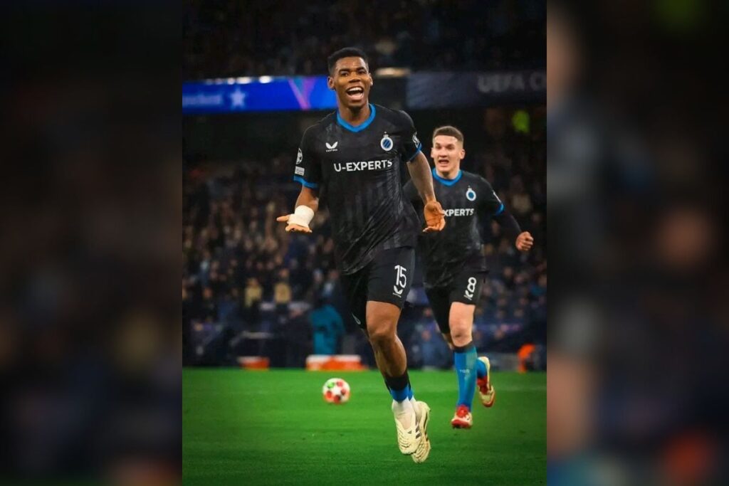 Raphael Onyedika celebrating his goal against Manchester City in the UEFA Champions League. 