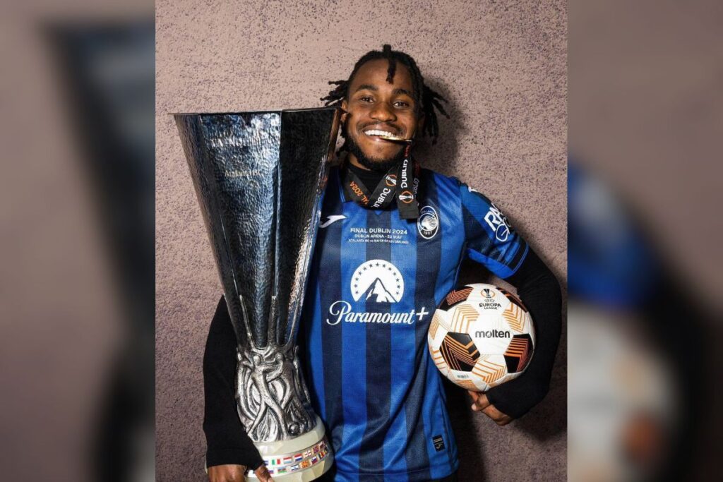 Ademola Lookman with the Europa League trophy, medal and the man of the match ball.