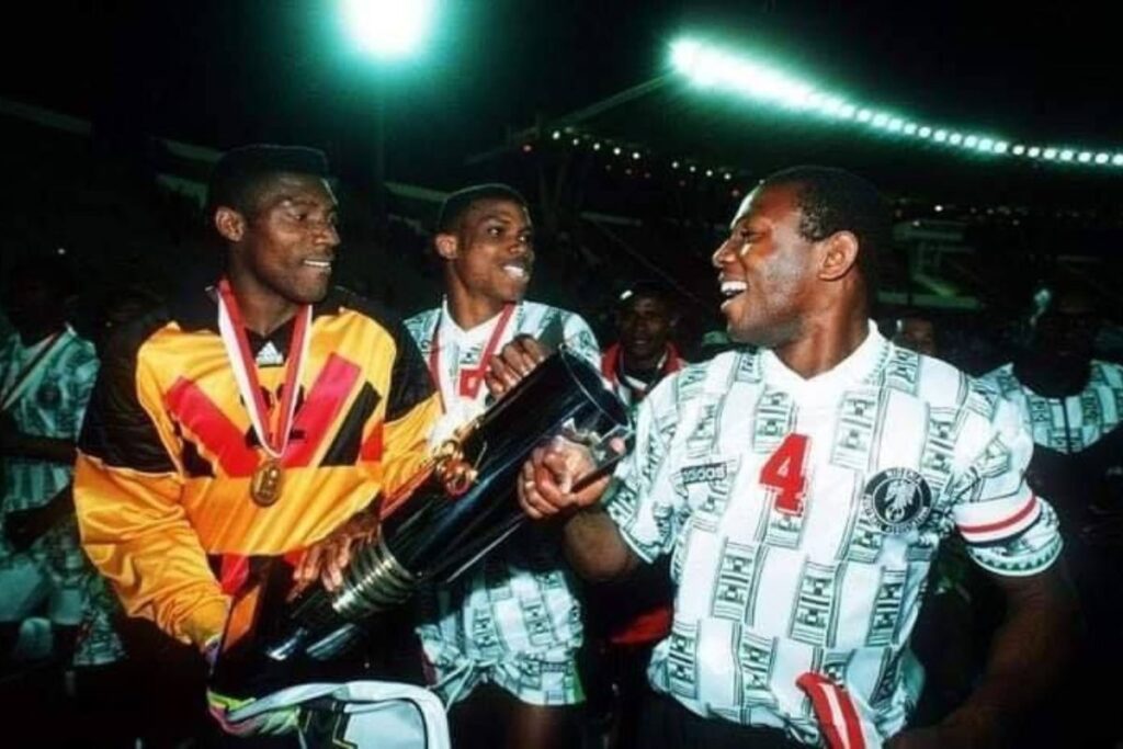 Peter Rufai, Sunday Oliseh and Stephen Keshi with the 1994 AFCON trophy.