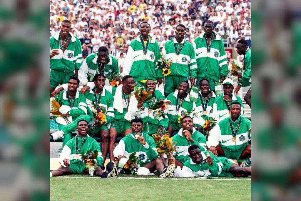 Nigeria's Dream Team posing with their Olympic gold medals at the podium. 