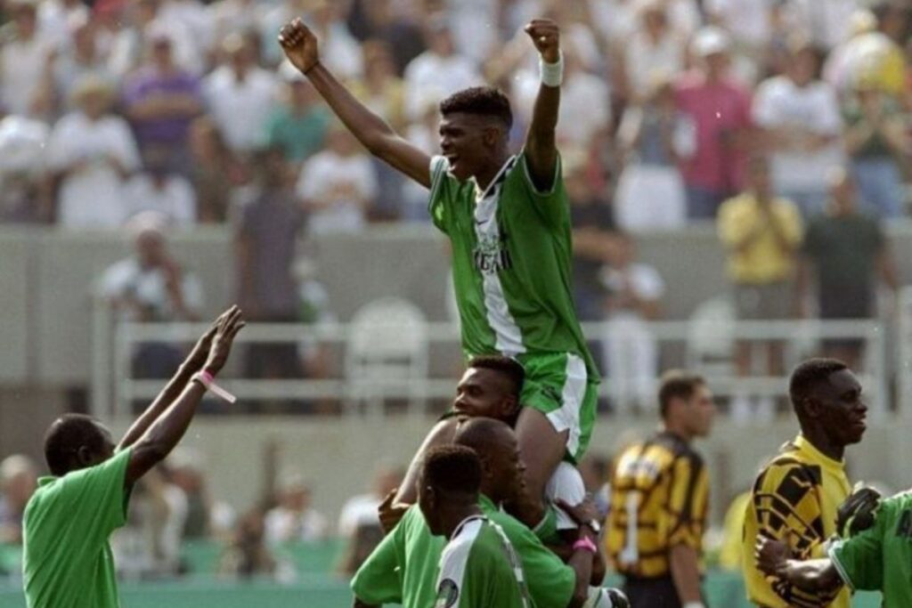 Kanu Nwankwo celebrating at the 1996 olympics.
