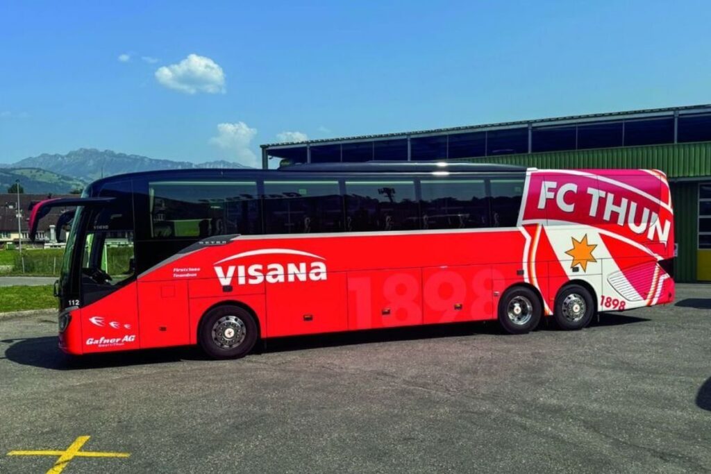 FC Thun's recently acquired new team bus showing new stadium owners Visana.